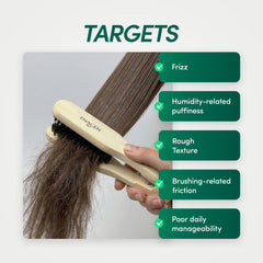 EnagenBio Doublet Anti-Frizz Smoothing Brush - natural boar bristles - hand clamping a hair section in the brush